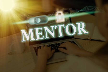 Writing note showing Mentor. Business concept for the an individual who trains and guides someone who has the potentialの写真素材