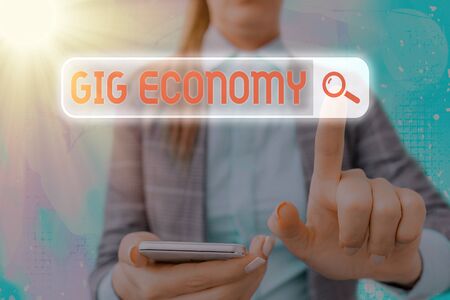 Text sign showing Gig Economy. Business photo text a market system distinguished by shortterm jobs and contractsの写真素材