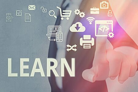 Conceptual hand writing showing Learn. Concept meaning process of acquiring new modifying existing knowledge behaviorsの写真素材