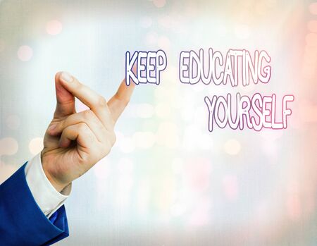 Handwriting text Keep Educating Yourself. Conceptual photo dont stop studying Improve yourself using Coursesの写真素材