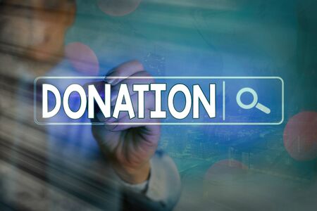 Writing note showing Donation. Business concept for the making of a gift especially to charity or public institutionの写真素材