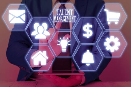 Writing note showing Talent Management. Business concept for develop the most talented superior employees availableの写真素材