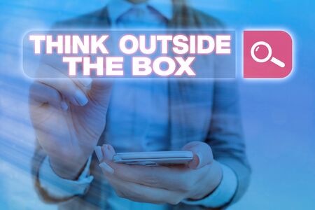 Handwriting text Think Outside The Box. Conceptual photo Learn to adopt new ideas and make in a creative wayの写真素材