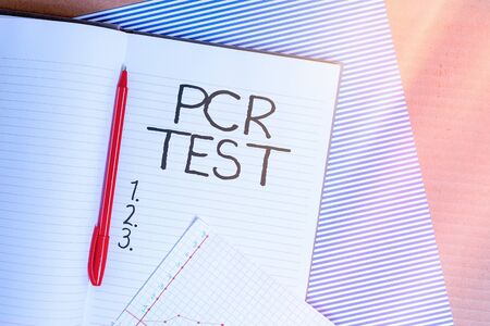 Conceptual hand writing showing Pcr Test. Concept meaning qualitative detection of viral genome within the short seqeunce of DNA Striped paperboard cardboard office study supplies chartの写真素材
