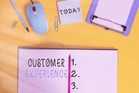 Word writing text Customer Experience. Business photo showcasing phrase to describe relationship user has with business Clipboard sheet clip striped notepad mouse markers note colored backgroundの写真素材