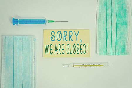 Conceptual hand writing showing Sorry, We Are Closed. Concept meaning apologize for shutting off business for specific time Set of medical equipment with notepad for health assessmentの写真素材
