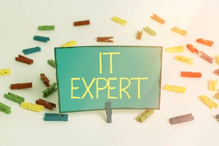 Word writing text It Expert. Business photo showcasing expertise when dealing with database system, and technology Colored clothespin papers empty reminder white floor background officeの写真素材
