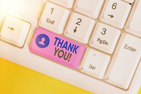 Conceptual hand writing showing Thank You. Concept meaning polite expression to acknowledge a gift, service or compliment White pc keyboard with empty note paper above white key copy spaceの写真素材