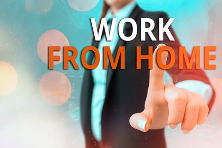 Writing note showing Work From Home. Business concept for communicating with the company mainly from home flexibly Touch screen digital marking important details in businessの写真素材