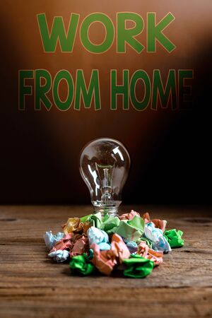 Text sign showing Work From Home. Business photo showcasing communicating with the company mainly from home flexibly Realistic colored vintage light bulbs, idea sign solution thinking conceptの写真素材