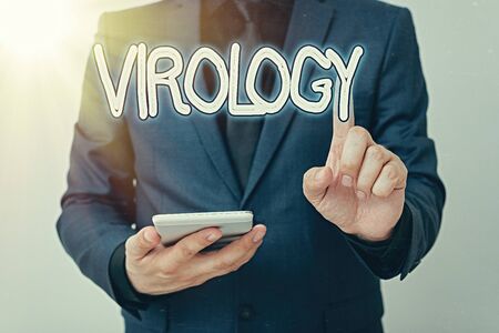 Writing note showing Virology. Business concept for branch of science dealing with the variety of viral agents and disease Model with pointing hand finger symbolizing navigation progress growthの写真素材
