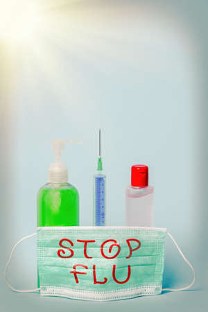 Word writing text Stop Flu. Business photo showcasing put an end of the viral infection of your lungs and airways Primary medical precautionary equipments for health care protectionの写真素材