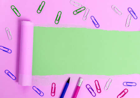 Rolled Ripped Torn Cardboard Placed Above A Wooden Classic Table Backdropの写真素材