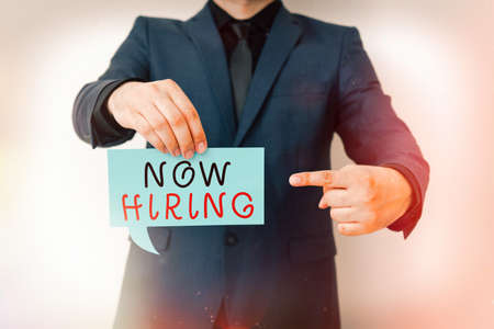 Handwriting text Now Hiring. Conceptual photo an act of starting to employ someone qualified for the position Displaying different color sticker notes mock-up for emphasizing contentの写真素材