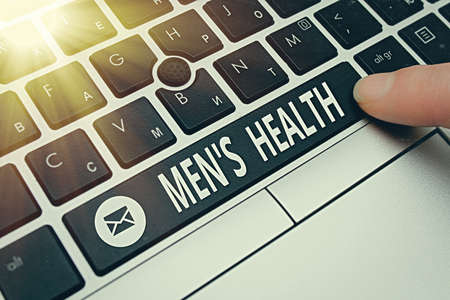 Conceptual hand writing showing Mens Health. Concept meaning state of complete and social wellbeing as experienced by men Pc keyboard key with pointing finger above background copy spaceの写真素材
