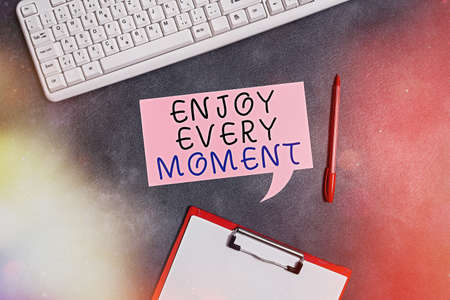 Conceptual hand writing showing Enjoy Every Moment. Concept meaning stay positive thinking for an...