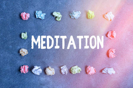 Handwriting text writing Meditation. Conceptual photo achieve a mentally clear and emotionally calm and stable state Paper accesories with digital smartphone arranged on different backgroundの写真素材