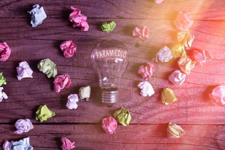 Conceptual hand writing showing Paramedic. Concept meaning a health worker having an expertise in emergency medical work Realistic colored vintage light bulbs, idea sign solutionの写真素材