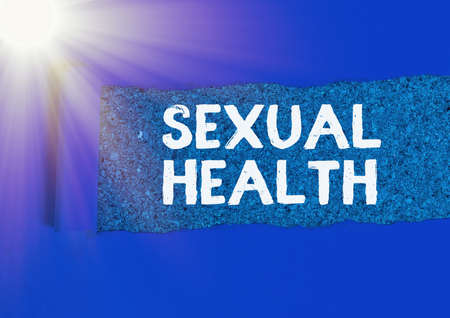 Word writing text Sexual Health. Business photo showcasing Ability to embrace and enjoy sexuality throughout our lives Rolled ripped torn cardboard placed above a wooden classic table backdropの写真素材