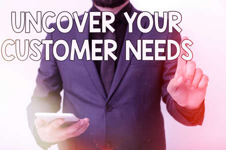 Conceptual hand writing showing Uncover Your Customer Needs. Concept meaning reveal product and present solution to consumer Model pointing finger symbolizing navigation progress growthの写真素材