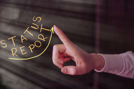 Writing note showing Status Report. Business concept for summarizes the particular situation as of a...