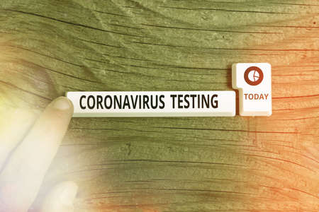 Conceptual hand writing showing Coronavirus Testing. Concept meaning Collection of samples from a viable patient to identify SARSCoV2 Pc keyboard key with note paper above background copy spaceの写真素材