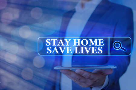 Handwriting text Stay Home Save Lives. Conceptual photo lessen the number of infected patients by not leaving the house Web search digital information futuristic technology network connectionの写真素材