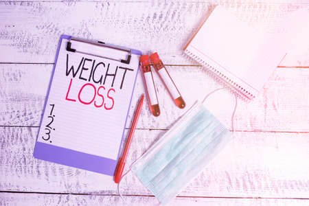 Conceptual hand writing showing Weight Loss. Concept meaning a reduction of the total body mass due...