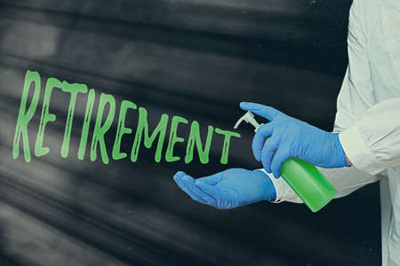 Handwriting text writing Retirement. Conceptual photo withdrawal from one s is occupation or from active working life Displaying Empty Sticker Paper Accessories Smartphone With Medical Gloves Onの写真素材