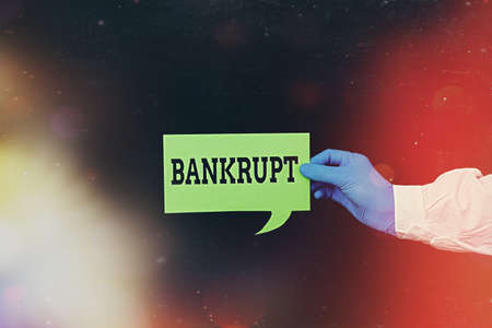 Word writing text Bankrupt. Business photo showcasing reduced to a state of financial ruin or exhausted of something Displaying Empty Sticker Paper Accessories Smartphone With Medical Gloves Onの写真素材