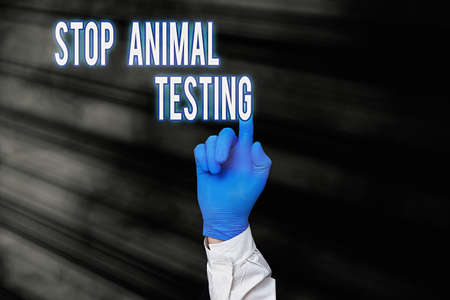 Word writing text Stop Animal Testing. Business photo showcasing put an end on animal experimentation or research Displaying Empty Sticker Paper Accessories Smartphone With Medical Gloves Onの写真素材