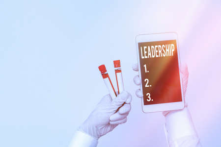 Handwriting text writing Leadership. Conceptual photo ability to guide others without force into direction or decision Extracted blood sample vial with lastest technology ready for examinationの写真素材