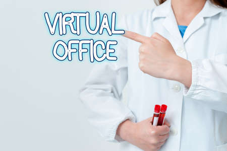Writing note showing Virtual Office. Business concept for operational domain of any business or organization virtually Empty sticker paper accessories smartphone with medical gloves onの写真素材