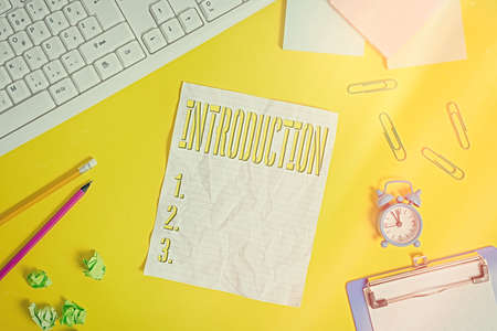 Writing note showing Introduction. Business concept for act or process of introducing : the state of being introduced Flat lay above copy space on the white crumpled paperの写真素材