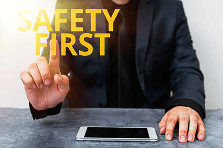 Handwriting text writing Safety First. Conceptual photo used to say that the most important thing is...