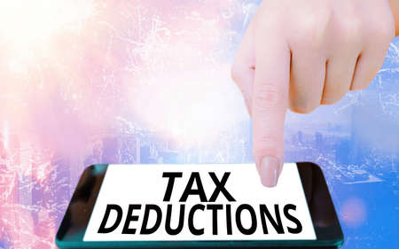 Conceptual hand writing showing Tax Deductions. Concept meaning an amount or cost that subtracted...