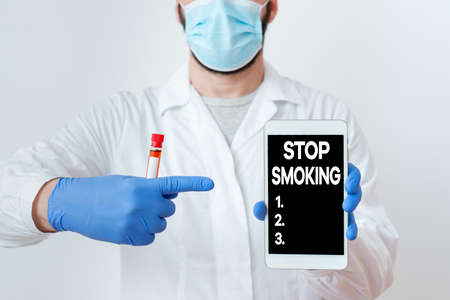 Writing note showing Stop Smoking. Business concept for Discontinuing or stopping the use of tobacco addiction Laboratory Blood Test Sample Shown For Medical Diagnosticの写真素材