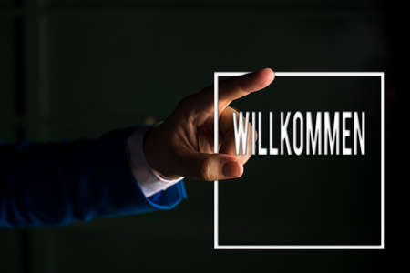Text sign showing Willkommen. Business photo text welcoming showing event or your home something to that effect digital arrowhead curve rising upward denoting growth development conceptの写真素材