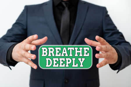Word writing text Breathe Deeply. Business photo showcasing to take a lot of air into the lungs inhaleexhale fully Model with pointing hand finger symbolizing navigation progress growthの写真素材