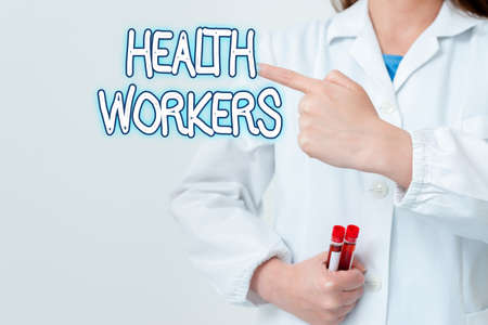 Writing note showing Health Workers. Business concept for showing whose job to protect the health of their communities Empty sticker paper accessories smartphone with medical gloves onの写真素材