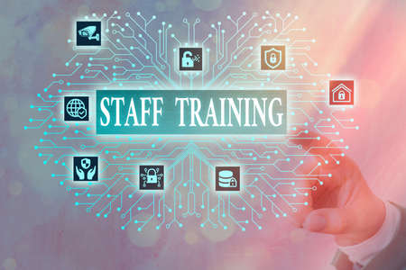 Writing note showing Staff Training. Business concept for program that helps employees learn...