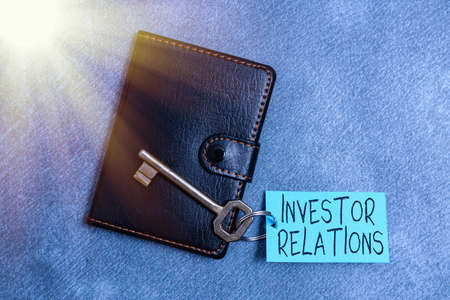 Text sign showing Investor Relations. Business photo text management responsibility that integrates finance Paper accesories with digital smartphone arranged on different backgroundの写真素材