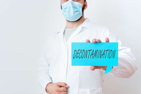 Text sign showing Decontamination. Business photo text neutralizing every presence of hazardous substances Laboratory Technician Featuring Empty Sticker Paper Accessories Smartphoneの写真素材