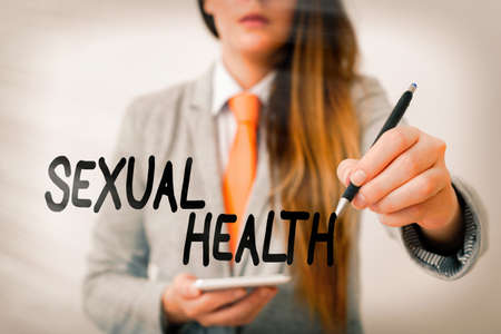Word writing text Sexual Health. Business photo showcasing positive and respectful approach to sexual relationships Model displaying different shots of holding pen ready for promotional useの写真素材