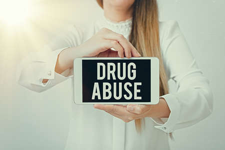 Text sign showing Drug Abuse. Business photo showcasing the habitual taking of use of prescription or illegal drugs Model displaying black screen modern smartphone mock-up for personal interestの写真素材