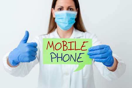 Word writing text Mobile Phone. Business photo showcasing A handheld device used to send receive calls and messages Laboratory technician featuring empty sticker paper accessories smartphoneの写真素材