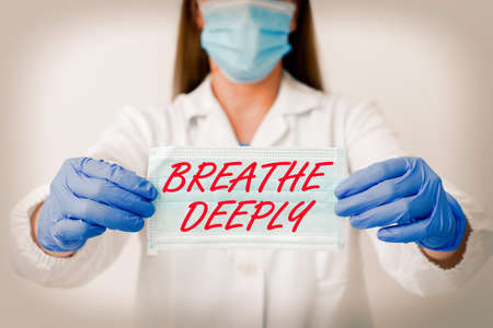 Text sign showing Breathe Deeply. Business photo showcasing to take a lot of air into the lungs inhale exhale fully Laboratory blood test sample shown for medical diagnostic analysis resultの写真素材