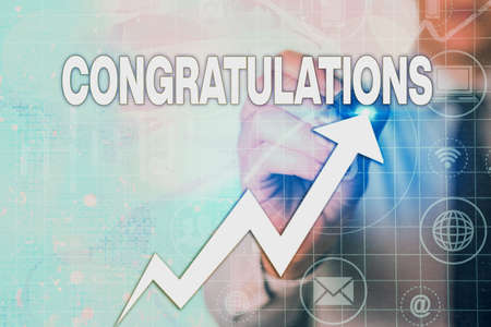 Writing note showing Congratulations. Business concept for a congratulatory expression usually used in plural form Arrow symbol going upward showing significant achievementの写真素材