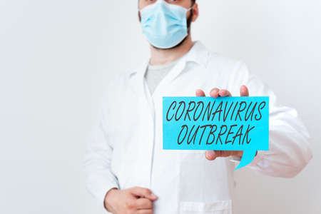 Text sign showing Coronavirus Outbreak. Business photo text infectious disease caused by newly discovered COVID19 Laboratory Technician Featuring Empty Sticker Paper Accessories Smartphoneの写真素材