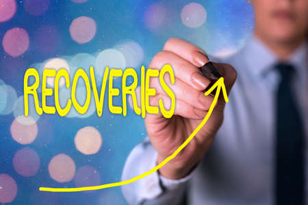 Text sign showing Recoveries. Business photo text process of regaining possession or control of something lost digital arrowhead curve rising upward denoting growth development conceptの写真素材